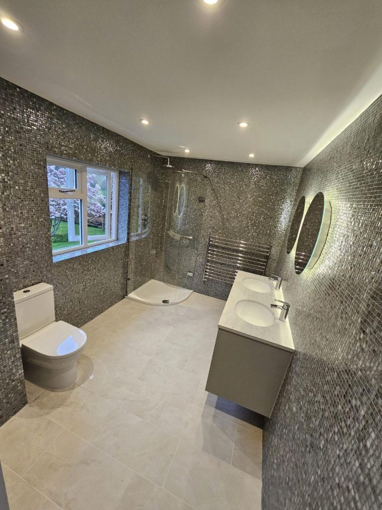 Sparkling mosaic-tiled bathroom with modern fixtures