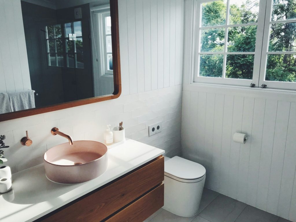 Minimalist design with pink sink and wood