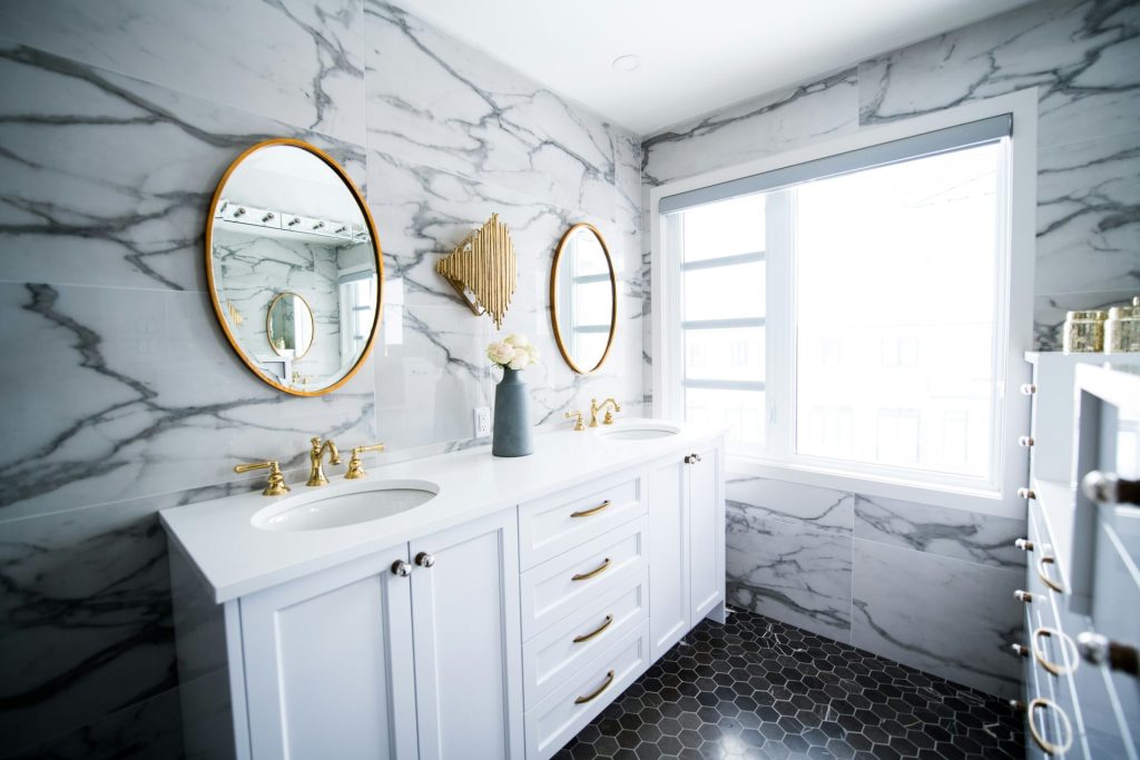 Luxurious marble bathroom with gold accent fixtures